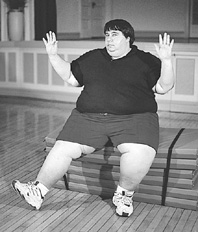 Photo of a man performing chair aerobics